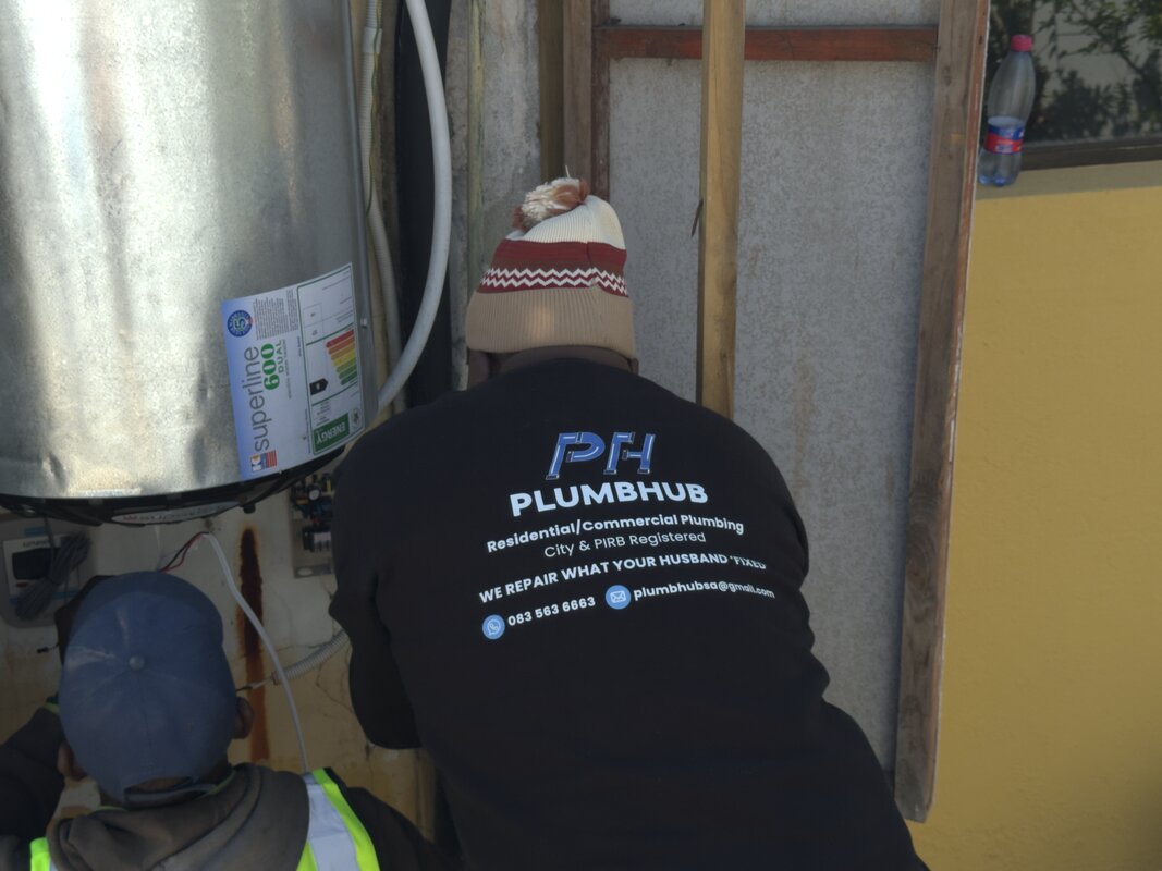 Plumbhub plumbers installing a geyser
